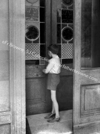 BOY AT DOOR OF MOUNT ST ANNE'S